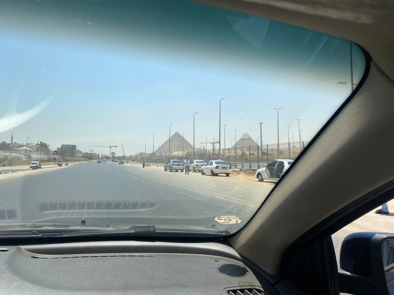 On the road during the first trip to Cairo, with the Giza pyramids ahead